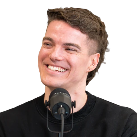 Cutout of Ben Walsham smiling at a podcast microphone
